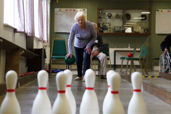 Woman playing skittles