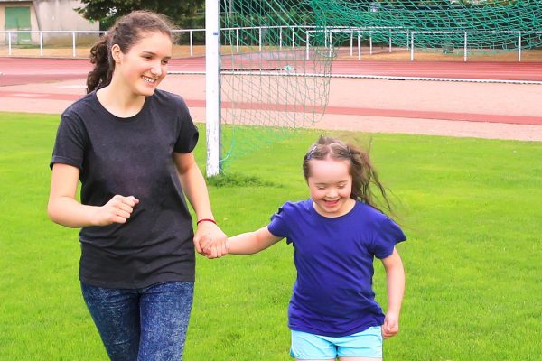 A woman and child on a playing field